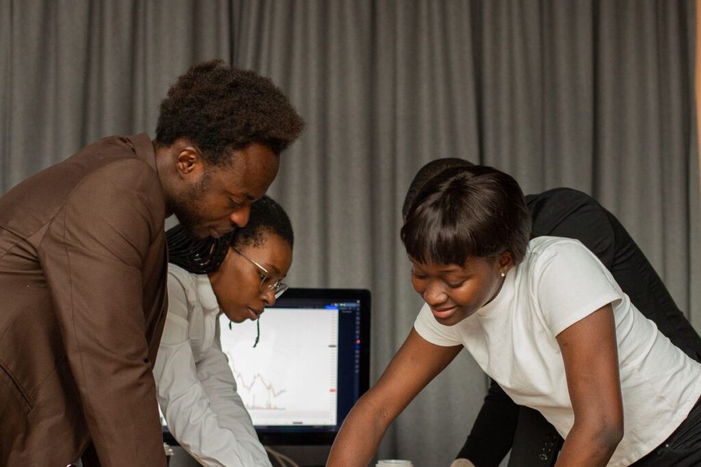 Colleagues working together at a computer
